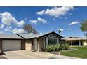 Attractive single-story home with well-kept landscaping and a garage, ideal for comfortable suburban living at 8632 E Thornwood Dr, Scottsdale, AZ 85251