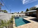 Backyard oasis featuring a pristine pool and spa, perfect for relaxation and outdoor entertainment at 8632 E Thornwood Dr, Scottsdale, AZ 85251
