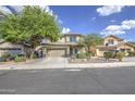 Inviting home with two-car garage, manicured desert landscaping, and a welcoming front entrance at 11629 W Washington St, Avondale, AZ 85323