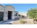 Inviting single-story home featuring desert landscaping, a covered entry and a window at 1246 E Thomas Dr, Casa Grande, AZ 85122