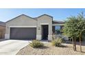 Inviting single-story home with a well-manicured desert landscape and charming front entry at 1246 E Thomas Dr, Casa Grande, AZ 85122