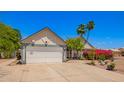 Charming home featuring a two-car garage, lush landscaping, and a stone walkway at 12529 N 83Rd Ln, Peoria, AZ 85381