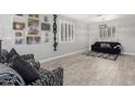 Bright living room featuring plantation shutters, stylish decor, and comfortable seating at 13005 W Vista Paseo Dr, Litchfield Park, AZ 85340