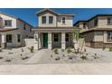 Attractive two-story house featuring a inviting front porch, low maintenance desert landscaping at 15593 S 180Th Ln, Goodyear, AZ 85338