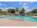 Enjoy the community pool with well-maintained landscaping and seating areas at 2286 E Mohave Ln, Apache Junction, AZ 85119