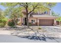 Beautiful two-story home with well-maintained landscaping and a spacious driveway at 4293 S Columbine Way, Gold Canyon, AZ 85118