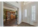 Welcoming foyer with views into the living area featuring a large bookcase at 4293 S Columbine Way, Gold Canyon, AZ 85118