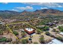 Expansive desert property featuring a well-maintained home with desert landscaping, outlined in a yellow boundary at 44421 N 12Th St, New River, AZ 85087