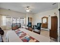 Comfortable living room with neutral walls, carpet, traditional furnishings, and natural light at 44421 N 12Th St, New River, AZ 85087