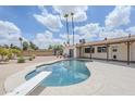 Spacious backyard boasts a sparkling in-ground pool and diving board, perfect for outdoor entertaining at 11631 N 30Th St, Phoenix, AZ 85028