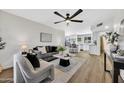 Open concept living room featuring stylish decor and hardwood flooring at 156 E Jasmine St, Mesa, AZ 85201