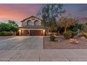 Beautiful two-story home featuring a three-car garage, well-maintained landscaping, and a spacious driveway at 194 E Canyon Creek Dr, Gilbert, AZ 85295
