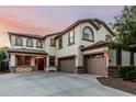 Charming two-story home with a three-car garage, beautiful windows, and a well-maintained yard at 2556 E Quiet Hollow Ln, Phoenix, AZ 85024