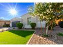 Attractive home featuring an attached garage and manicured front yard at 2618 E Stacey Rd, Gilbert, AZ 85298