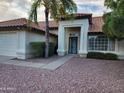 Attractive home exterior boasting a tiled roof and tidy desert landscaping leading to a bright entryway at 4534 E Villa Maria Dr, Phoenix, AZ 85032