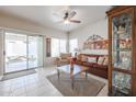 Bright living room with sliding glass doors to the patio at 4912 W Marco Polo Rd, Glendale, AZ 85308