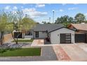 Beautifully renovated single-story home with a modern exterior and desert landscaping at 8732 E Arlington Rd, Scottsdale, AZ 85250