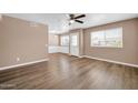 Bright living room with vinyl floors and ceiling fan, with an open floor plan at 9639 W Cinnabar Ave # A, Peoria, AZ 85345