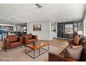 Cozy living room with plush leather seating, modern decor, and an open floor plan perfect for entertaining and relaxation at 120 N Val Vista Dr # 178, Mesa, AZ 85213