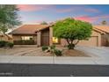 Charming single-story home with a tile roof, desert landscaping, and a well-manicured front yard at 13361 N 99Th Pl, Scottsdale, AZ 85260