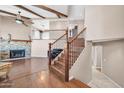 Entryway leading to a living area with a fireplace, stairs to the second floor, and hardwood floors at 16805 S 29Th Pl, Phoenix, AZ 85048
