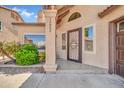Close up of front entrance with decorative security door, manicured landscaping, and house number at 16805 S 29Th Pl, Phoenix, AZ 85048