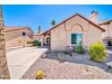 Single-story home with desert landscaping, including rock and cactus features at 16805 S 29Th Pl, Phoenix, AZ 85048