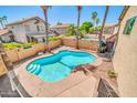 Beautiful kidney-shaped pool with patio area and desert landscaping at 16805 S 29Th Pl, Phoenix, AZ 85048