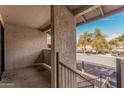 Patio with view of the community parking lot and mature trees at 234 N 75Th St # 209, Mesa, AZ 85207