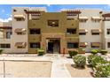 Exterior building view featuring a stairway entrance with patios and awnings at 3434 E Baseline Rd # 216, Phoenix, AZ 85042