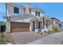 Beautiful home featuring neutral color palette, desert landscaping, brick driveway, and attached garage at 6722 N 9Th Dr, Phoenix, AZ 85013