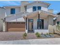 Beautiful home with desert landscaping and a well-maintained brick driveway leading to a garage at 6722 N 9Th Dr, Phoenix, AZ 85013