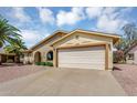Lovely single-story home featuring a two-car garage, brick accents, and a well-maintained driveway at 811 S 79Th Way, Mesa, AZ 85208