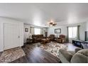 Bright living room with hardwood floors, ceiling fan, and comfortable seating at 8943 W Sierra Vista Dr, Glendale, AZ 85305