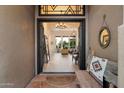 Inviting entryway view to the living room with natural light and stylish decor throughout at 9675 E Roadrunner Dr, Scottsdale, AZ 85262