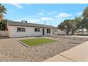 Well-maintained exterior with desert landscaping and a small patch of green grass at 1205 W 7Th St, Tempe, AZ 85281