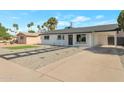 Charming single-story home with stylish desert landscaping and carport at 1205 W 7Th St, Tempe, AZ 85281
