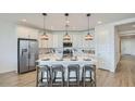 Open-concept kitchen featuring a large island with counter seating at 1516 W Ridge Rd, Apache Junction, AZ 85120