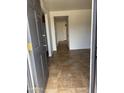 Inviting entryway features neutral tile flooring, offering a clean and modern welcome at 1714 W Villa Rita Dr, Phoenix, AZ 85023