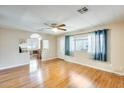 Inviting living room with wood floors, natural light, and view of the kitchen at 205 S Higley Rd # 293, Mesa, AZ 85206