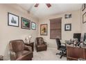 Cozy bedroom features wood accents and comfortable office and sitting space at 2748 E Dennisport Ave, Gilbert, AZ 85295