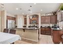 Well-appointed kitchen with granite countertops, stainless steel appliances, and dark cabinetry at 2748 E Dennisport Ave, Gilbert, AZ 85295