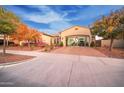 Front exterior of home with an open garage showcasing plenty of space at 4571 N Arbor Way, Buckeye, AZ 85396