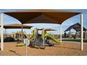 Community playground area with slides and various play structures at 4642 E Topaz Dr, San Tan Valley, AZ 85143