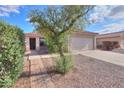 Charming single-story home featuring a well-maintained yard and a two-car garage at 537 W Kingman Dr, Casa Grande, AZ 85122
