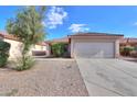 Charming single-story home featuring a well-maintained yard and a two-car garage at 537 W Kingman Dr, Casa Grande, AZ 85122