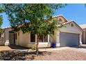 Inviting single-story home featuring a well-manicured lawn and a two-car garage at 840 E Baylor Ln, Chandler, AZ 85225