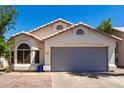 Charming single-story home with a two-car garage, neutral paint, and desert landscaping at 840 E Baylor Ln, Chandler, AZ 85225