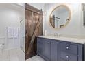 Modern bathroom featuring a barn door, stylish vanity, and glass-enclosed shower at 9450 E Becker Ln # 1046, Scottsdale, AZ 85260