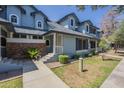 Inviting two-story townhouse with blue siding, brick accents, and well-maintained landscaping at 10101 N 91St Ave # 111, Peoria, AZ 85345